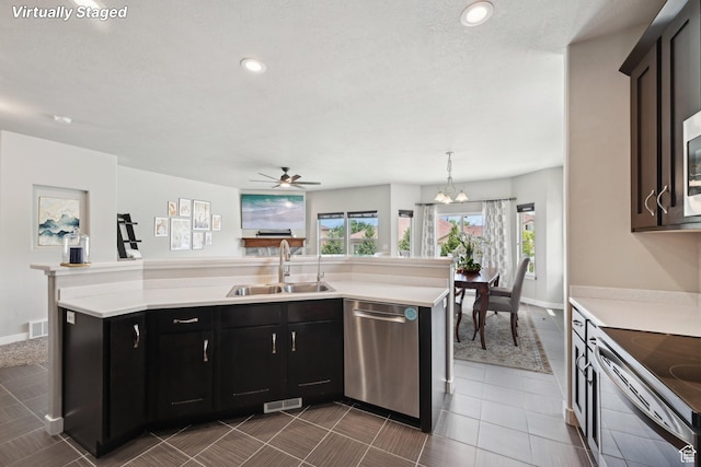 14499 S River Chase Rd, Herriman, UT 84096 - kitchen with appliances with stainless steel finishes, a sink, light countertops, ceiling fan, and recessed lighting
