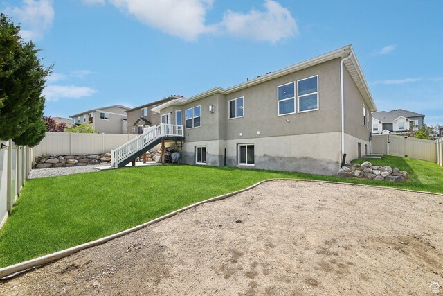 14499 S River Chase Rd, Herriman, UT 84096 - back of property with stairs, stucco siding, and a residential view