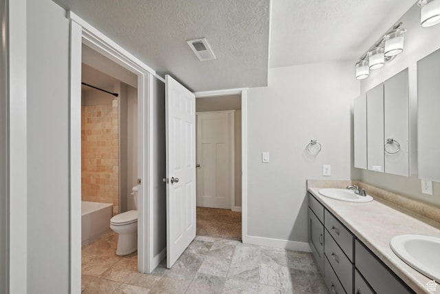 14499 S River Chase Rd, Herriman, UT 84096 - bathroom featuring double vanity, a textured ceiling, toilet, baseboards, and bathtub / shower combination