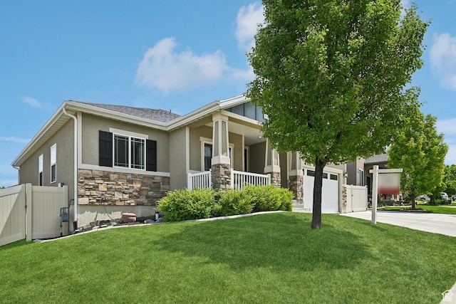 14499 S River Chase Rd, Herriman, UT 84096 - view of front facade featuring stone siding, driveway, a porch, stucco siding, and an attached garage