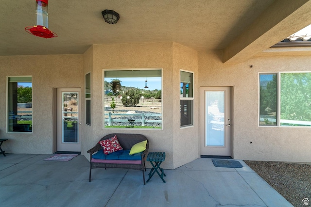814 N High Ground Dr, Dammeron Valley, UT 84783 - doorway to property with stucco siding and a patio area
