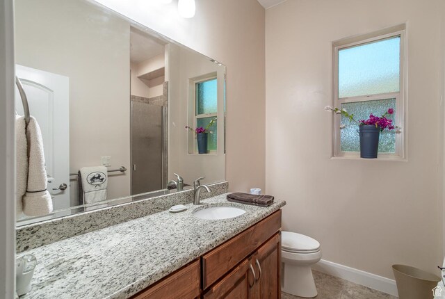 814 N High Ground Dr, Dammeron Valley, UT 84783 - full bathroom with vanity, a stall shower, toilet, baseboards, and tile patterned floors