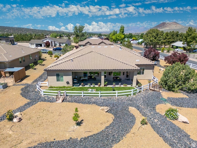 814 N High Ground Dr, Dammeron Valley, UT 84783 - back of property featuring stucco siding, a fenced backyard, a patio, and a tiled roof