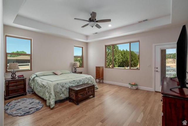 814 N High Ground Dr, Dammeron Valley, UT 84783 - bedroom featuring a tray ceiling, baseboards, light wood finished floors, recessed lighting, and a ceiling fan