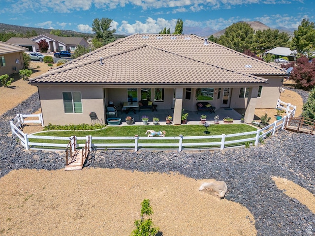814 N High Ground Dr, Dammeron Valley, UT 84783 - rear view of property with stucco siding, a tile roof, and a patio area