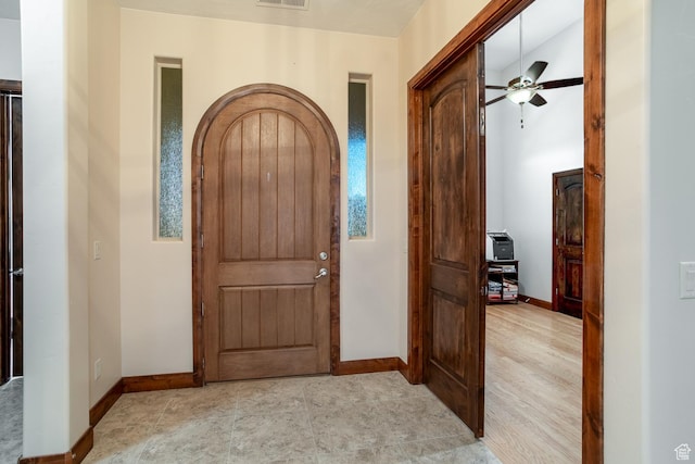 814 N High Ground Dr, Dammeron Valley, UT 84783 - foyer featuring baseboards, arched walkways, and a ceiling fan