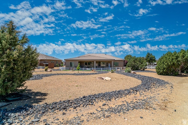 814 N High Ground Dr, Dammeron Valley, UT 84783 - back of house featuring a tiled roof and stucco siding