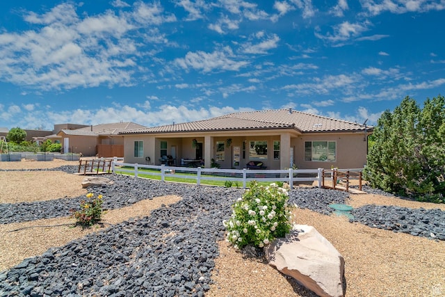 814 N High Ground Dr, Dammeron Valley, UT 84783 - rear view of house featuring stucco siding and a tiled roof