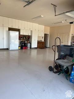 814 N High Ground Dr, Dammeron Valley, UT 84783 - garage with freestanding refrigerator