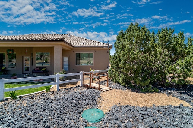 814 N High Ground Dr, Dammeron Valley, UT 84783 - view of home's exterior with a tiled roof and stucco siding