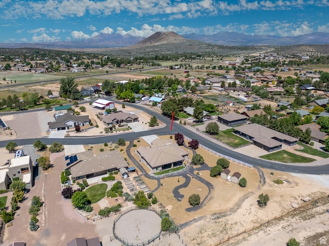 814 N High Ground Dr, Dammeron Valley, UT 84783 - aerial view of property and surrounding area featuring a mountain backdrop and nearby suburban area