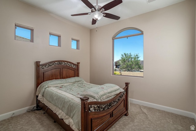 814 N High Ground Dr, Dammeron Valley, UT 84783 - bedroom featuring light carpet, multiple windows, and baseboards