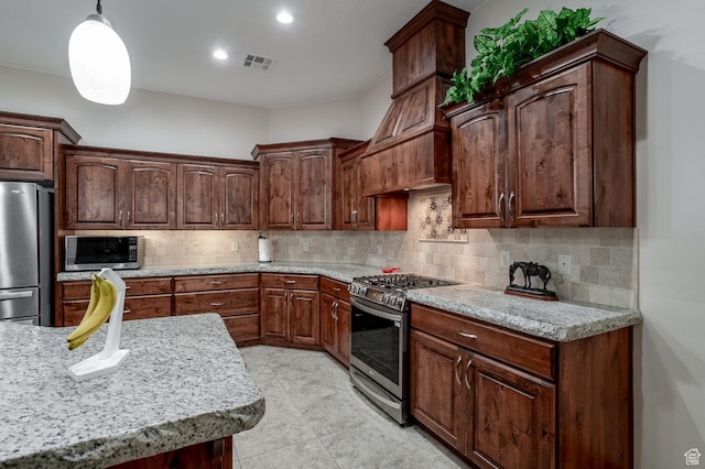 814 N High Ground Dr, Dammeron Valley, UT 84783 - kitchen with appliances with stainless steel finishes, decorative backsplash, pendant lighting, recessed lighting, and light stone countertops