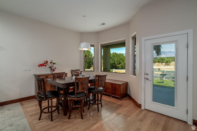 814 N High Ground Dr, Dammeron Valley, UT 84783 - dining room featuring light wood-style floors, plenty of natural light, and baseboards