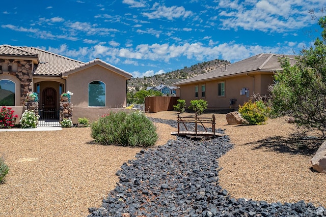 814 N High Ground Dr, Dammeron Valley, UT 84783 - view of side of home with a tiled roof and stucco siding