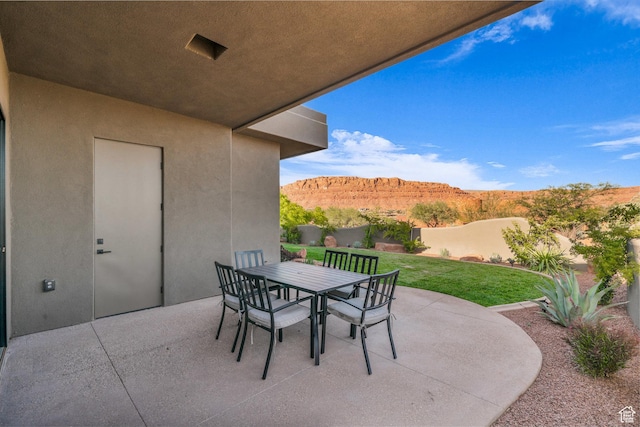 2549 W Sinagua Trl Unit 26, St George, UT 84770 - view of patio with a mountain view and outdoor dining area