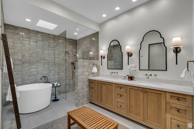 2549 W Sinagua Trl Unit 26, St George, UT 84770 - bathroom featuring double vanity, a soaking tub, a skylight, tile walls, and a tile shower