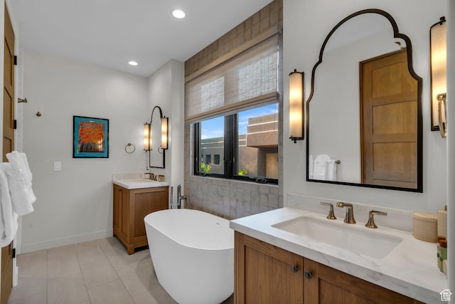 2549 W Sinagua Trl Unit 26, St George, UT 84770 - full bath with two vanities, a freestanding bath, tile patterned floors, baseboards, and recessed lighting