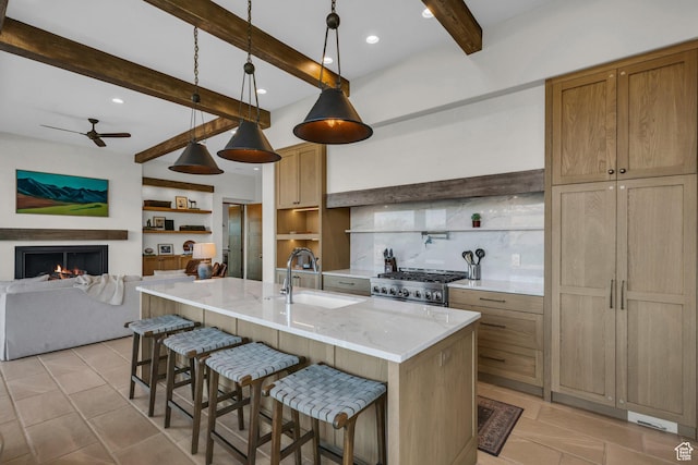 2549 W Sinagua Trl Unit 26, St George, UT 84770 - kitchen with a sink, open shelves, stove, beam ceiling, and ceiling fan