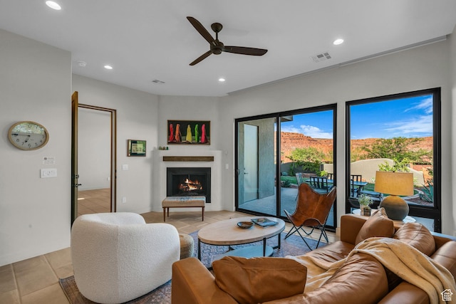 2549 W Sinagua Trl Unit 26, St George, UT 84770 - living area featuring a ceiling fan, a warm lit fireplace, and recessed lighting
