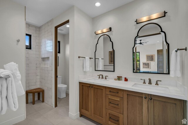 2549 W Sinagua Trl Unit 26, St George, UT 84770 - bathroom with toilet, double vanity, tile patterned flooring, and tiled shower