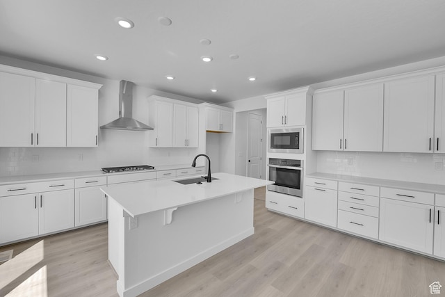 127 E Heron Ave Unit 808, Saratoga Springs, UT 84045 - kitchen featuring wall chimney exhaust hood, oven, a sink, built in microwave, and light wood-style floors