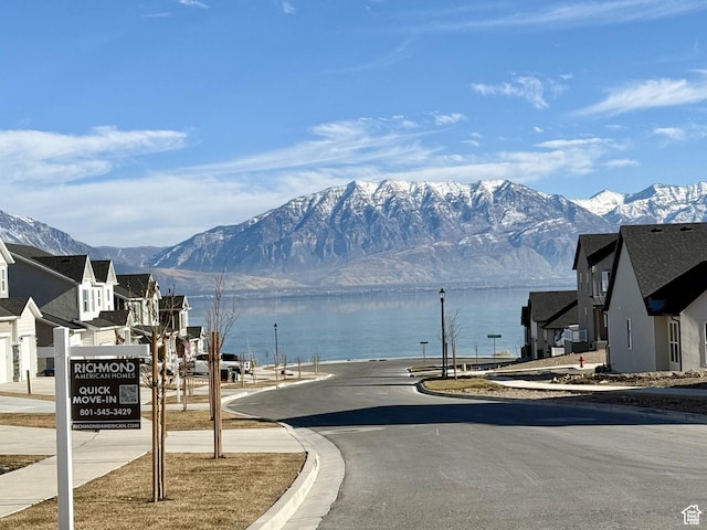 127 E Heron Ave Unit 808, Saratoga Springs, UT 84045 - view of asphalt road with curbs, a water and mountain view, and sidewalks