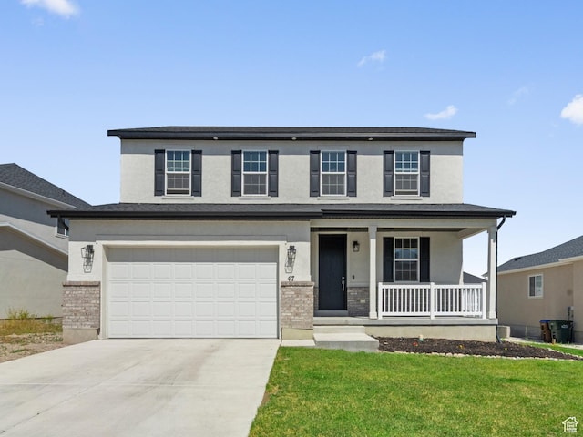 47 E Broxburn Way N, Tooele, UT 84074 - view of front of property with covered porch, driveway, a garage, and brick siding