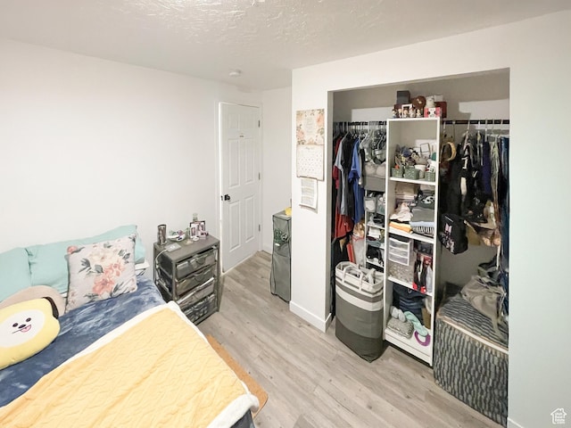 47 E Broxburn Way N, Tooele, UT 84074 - bedroom featuring wood finished floors, a closet, and baseboards