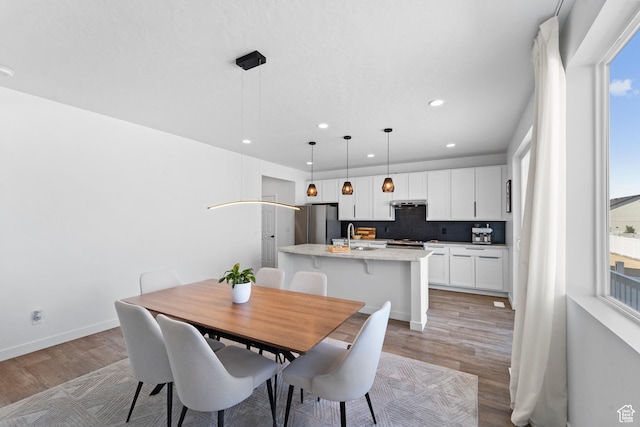 47 E Broxburn Way N, Tooele, UT 84074 - dining space with light wood-style flooring, recessed lighting, and baseboards