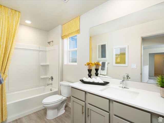 3453 S 3100 W Unit 0173, West Haven, UT 84401 - full bathroom featuring wood finished floors, shower / bathtub combination with curtain, toilet, vanity, and baseboards
