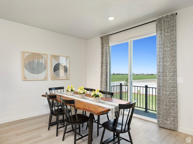3453 S 3100 W Unit 0173, West Haven, UT 84401 - dining area with healthy amount of natural light, light wood-style floors, baseboards, and recessed lighting