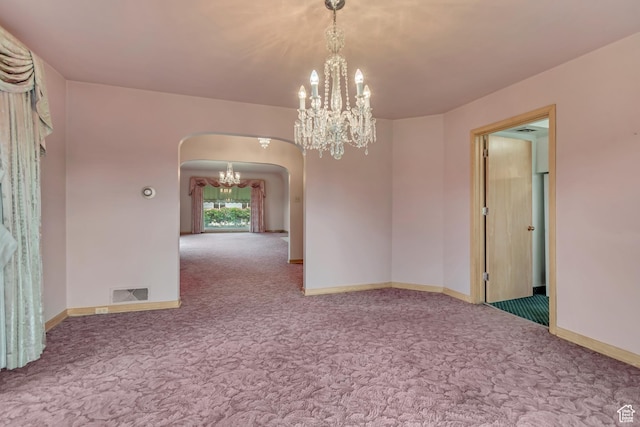 687 N Main St, Spanish Fork, UT 84660 - spare room featuring arched walkways, carpet, a chandelier, and baseboards