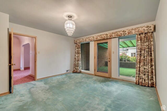 687 N Main St, Spanish Fork, UT 84660 - empty room with carpet floors, baseboards, and arched walkways