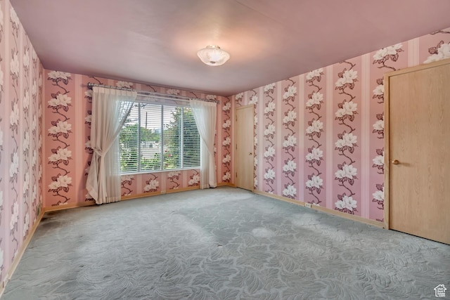 687 N Main St, Spanish Fork, UT 84660 - carpeted spare room with wallpapered walls and baseboards