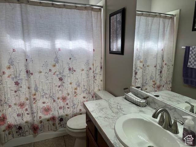 2025 E Skyline Dr, South Ogden, UT 84403 - full bathroom with vanity, toilet, and tile patterned flooring