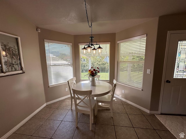 2025 E Skyline Dr, South Ogden, UT 84403 - dining space featuring a chandelier, tile patterned floors, and baseboards