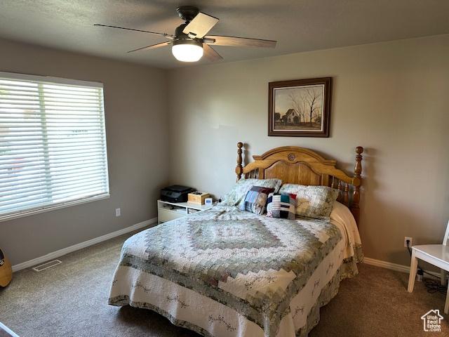 2025 E Skyline Dr, South Ogden, UT 84403 - carpeted bedroom featuring baseboards and a ceiling fan