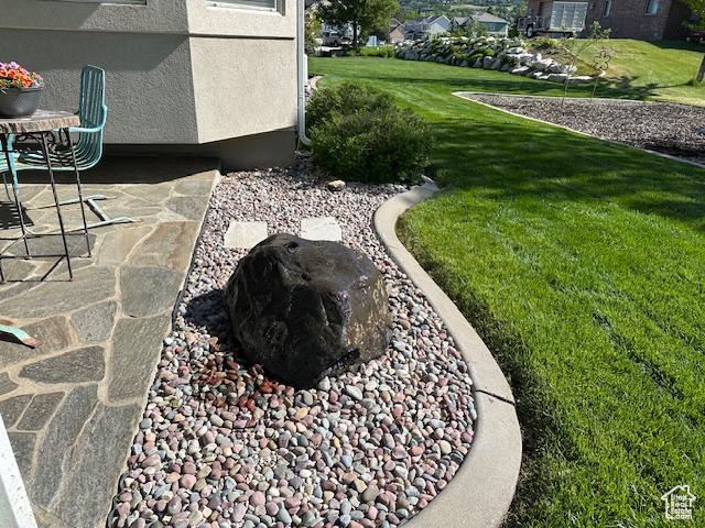 2025 E Skyline Dr, South Ogden, UT 84403 - view of grassy yard featuring a patio