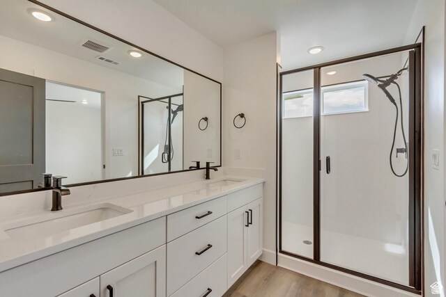 1471 E 1400 N Unit 55, Payson, UT 84651 - bathroom with a stall shower, double vanity, wood finished floors, and recessed lighting