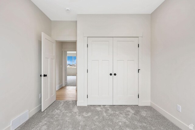 2409 W 3000 N, Farr West, UT 84404 - unfurnished bedroom featuring carpet flooring and a closet