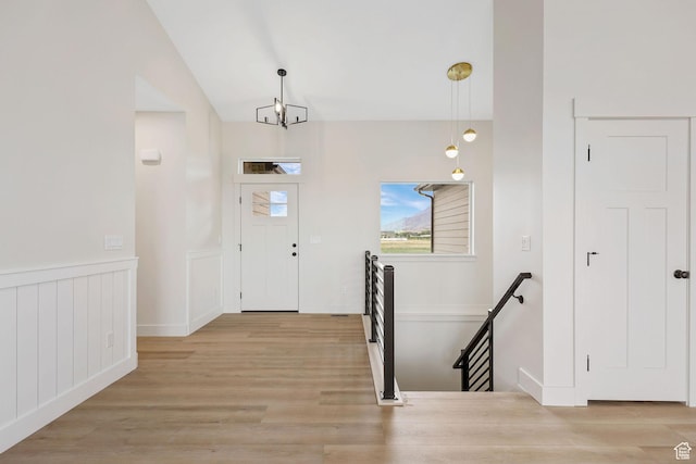 2409 W 3000 N, Farr West, UT 84404 - foyer entrance with light wood-type flooring and lofted ceiling