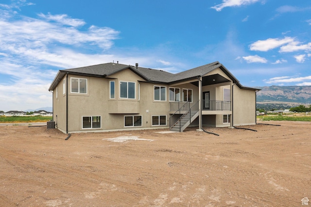 2409 W 3000 N, Farr West, UT 84404 - back of house featuring stucco siding, stairs, and a mountain view