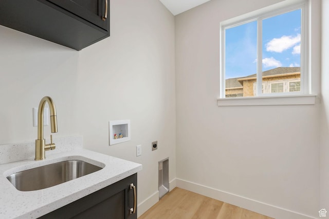 2409 W 3000 N, Farr West, UT 84404 - laundry room with electric dryer hookup, cabinet space, washer hookup, and light wood-style flooring