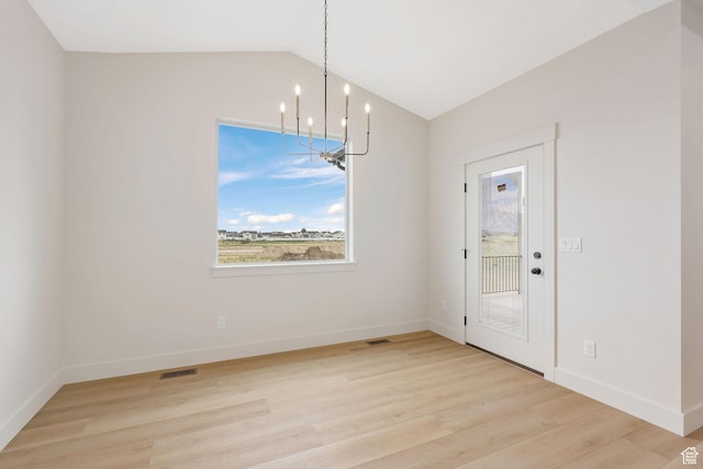 2409 W 3000 N, Farr West, UT 84404 - unfurnished dining area featuring a chandelier, light wood-type flooring, and vaulted ceiling