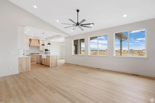 2409 W 3000 N, Farr West, UT 84404 - unfurnished living room featuring recessed lighting, light wood-style flooring, lofted ceiling, and a ceiling fan