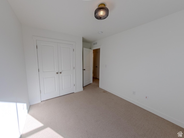 6654 W Skip Rock Rd S, South Jordan, UT 84009 - unfurnished bedroom featuring light colored carpet, baseboards, and a closet