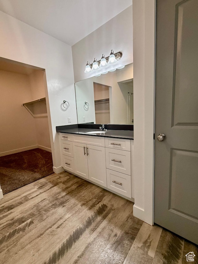 875 S Depot St Unit C211, Clearfield, UT 84015 - full bath with vanity, wood finished floors, a spacious closet, and baseboards