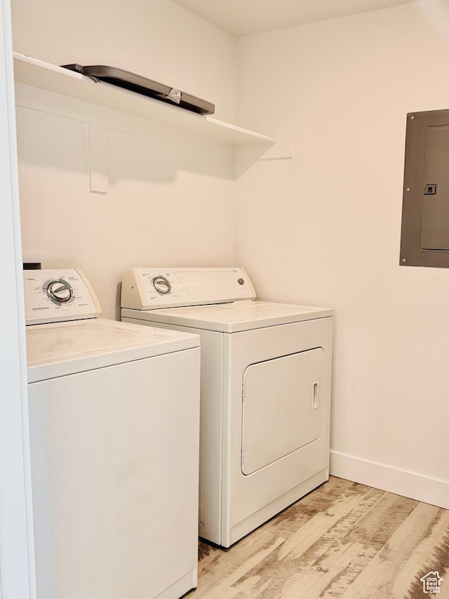 875 S Depot St Unit C211, Clearfield, UT 84015 - washroom featuring electric panel, independent washer and dryer, light wood-style flooring, and baseboards