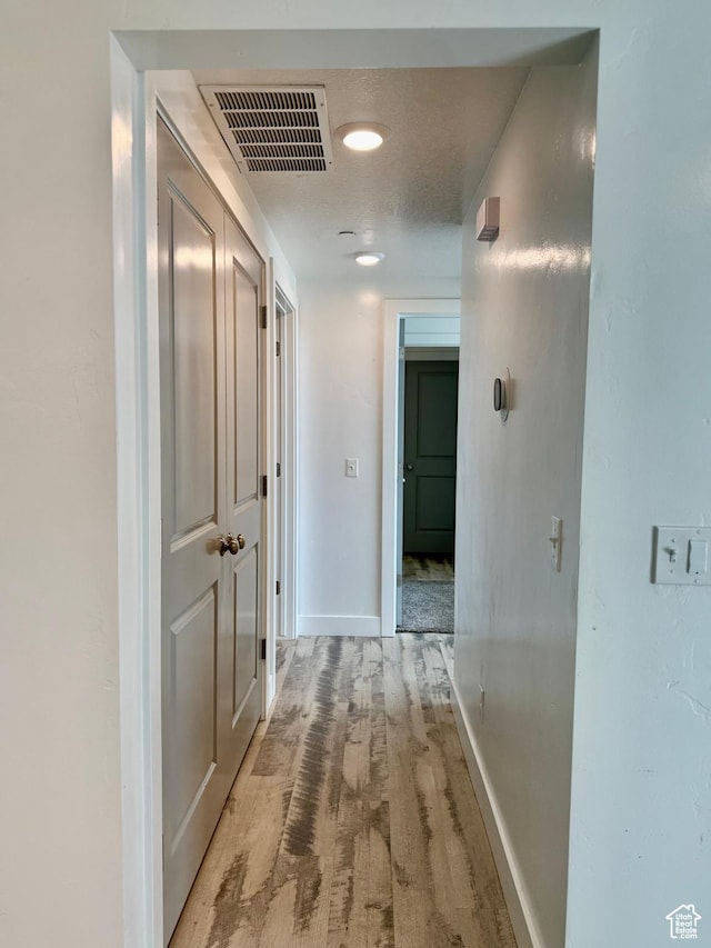 875 S Depot St Unit C211, Clearfield, UT 84015 - hallway with baseboards and light wood-type flooring